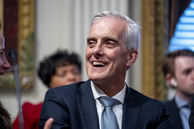 Veterans Affairs Secretary Denis McDonough laughs as he waits for a speech by President Joe Biden about supply chain issues in the Indian Treaty Room on the White House complex in Washington.