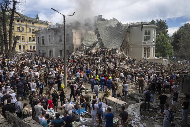 Rescuers and volunteers clean up the rubble and search for victims