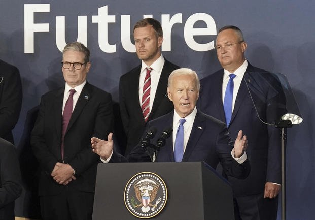 Britain's Prime Minister Keir Starmer, left, looks on as U.S. President Joe Biden speaks