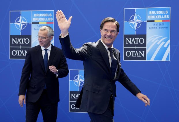 NATO Secretary General Jens Stoltenberg greets Dutch Prime Minister Mark Rutte. 