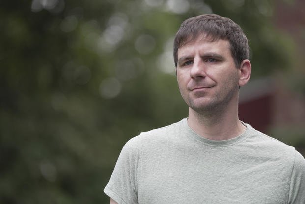 Casey Tylek, a U.S. Army veteran, stands for a portrait at his home