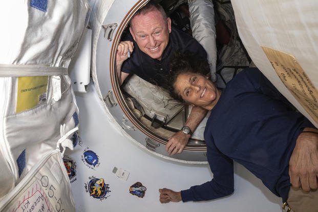 Boeing Crew Flight Test astronauts Butch Wilmore, left, and Suni Williams pose for a portrait .i