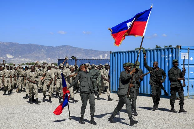 New members of the Armed Forces of Haiti celebrate after their graduation ceremony in Port-au-Prince