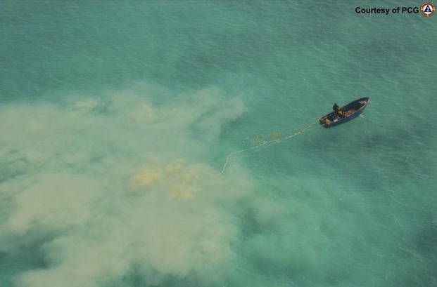 Chinese service boat scours the seabed as they search for giant clams in the Scarborough Shoal