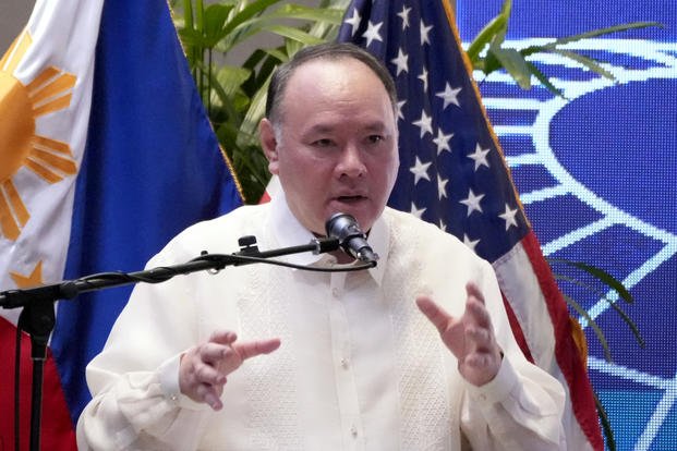 Philippine Defense Secretary Gilberto Teodoro Jr. gestures during his speech