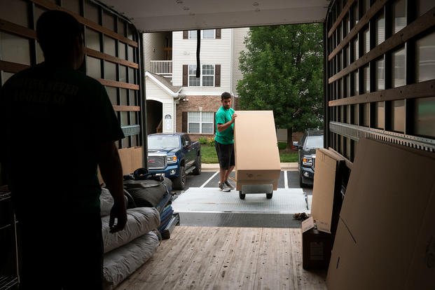 Movers pack items belonging to a U.S. soldier. (U.S. Transportation Command photo by Stephenie Wade)