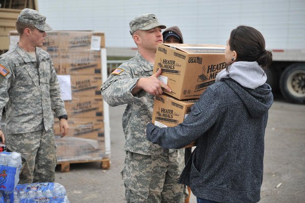 Soldiers of the New York Army National Guard provide relief supplies to Long Beach, N.Y., following severe damage caused by Hurricane Sandy