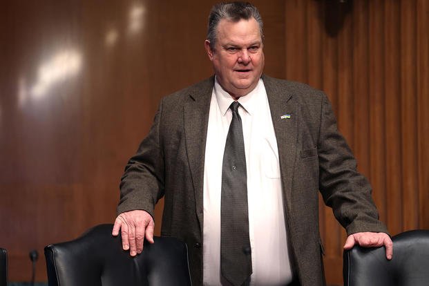 U.S. Sen. Jon Tester arrives for a Senate hearing