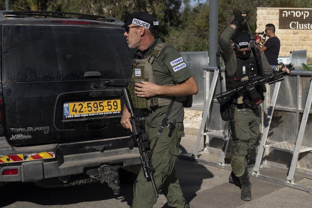 Israeli security forces secure a road 