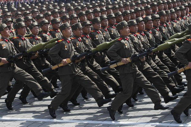 North Korean soldiers march during a mass military parade in Pyongyang's Kim Il Sung Square