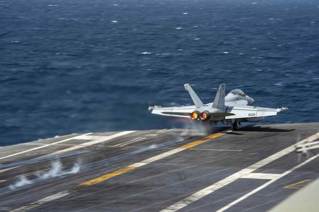 An E/A-18G Growler takes off from the USS Dwight D. Eisenhower