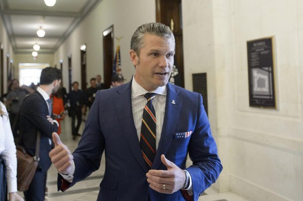 Pete Hegseth speaks with reporters