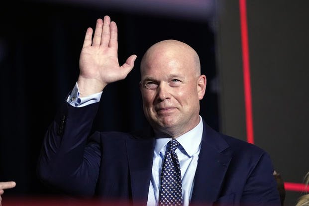 Former acting Attorney General Matt Whitaker waves