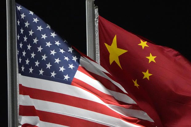 The American and Chinese flags wave at Genting Snow Park