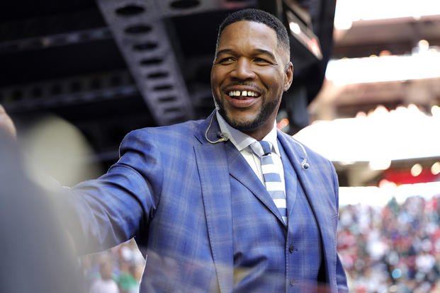 Fox Sports announcer Michael Strahan looks on before Super Bowl LVII on Feb. 12, 2023, in Glendale, Arizona. 