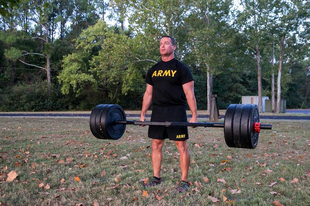 Maj. Bart Brimhall, the deputy product manager for missile field development, executes a weighted deadlift at Redstone Arsenal in Alabama.