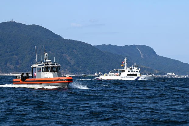 The crew aboard the U.S. Coast Guard Cutter Kimball’s 35-foot, long-range interceptor small boat prepares to conduct a joint search-and-rescue exercise in Kagoshima Bay, Japan, with a Japan Coast Guard AgustaWestland AW139 helicopter aircrew.