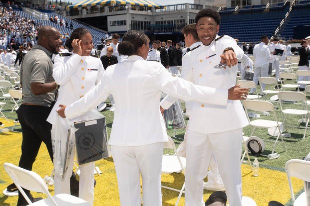 Class of 2024 U.S. Naval Academy graduates celebrate after the graduation ceremony in Annapolis, Maryland.