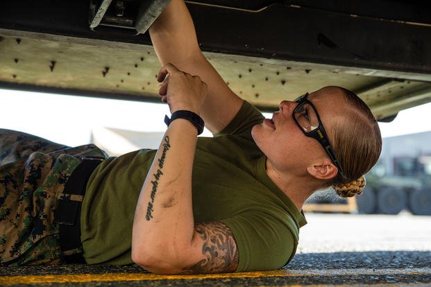 U.S. Marine Staff Sgt. Sara Thayer, maintenance chief with 1st Maintenance Battalion, 1st Marine Logistics Group, troubleshoots a transmission on a high mobility multipurpose wheeled vehicle on Camp Pendleton, Calif.