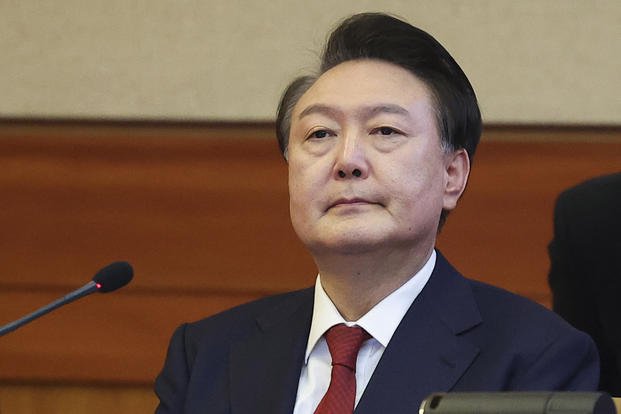 Impeached South Korean President Yoon Suk Yeol attends his impeachment trial at the Constitutional Court in Seoul, South Korea