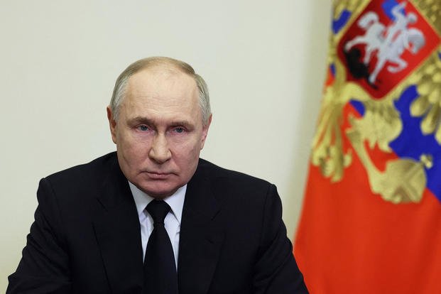 , Russia's President Vladimir Putin delivers an address 