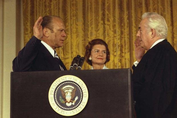 The swearing-in of U.S. President Gerald Ford by Supreme Court Chief Justice Warren Burger. Ford's wife, Betty, looks on. (Robert L. Knudsen/White House Press Office)