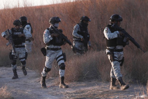 Mexican National Guard members patrol along the Mexico-US border in Ciudad Juarez