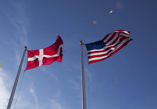 U.S. and Danish flags fly