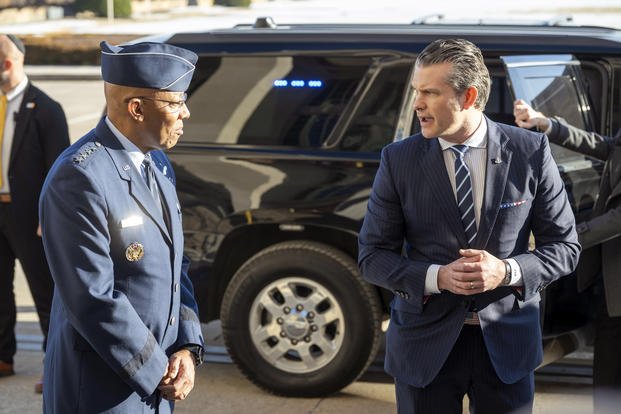 Defense Secretary Pete Hegseth looks toward Gen. Charles Q. Brown