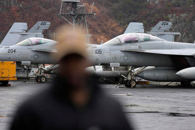 U.S. F-18 Super Hornet fighter jets are seen on the flight deck of the Nimitz-class nuclear-powered aircraft carrier USS Carl Vinson at a port in Busan