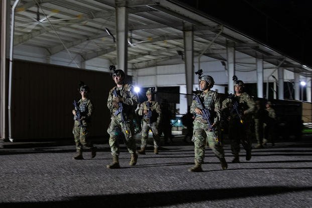 Soldiers assigned to the 190th Engineer Battalion, 101st Troop Command, Puerto Rico Army National Guard, ruck with their night-vision goggle equipment during annual training at Camp Santiago Joint Training Center, Salinas, Puerto Rico.