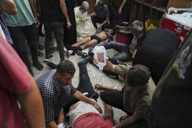 Palestinians wounded during Israeli strikes are treated 