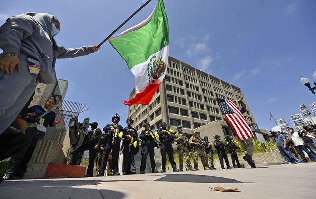 Police stand guard in Santa Ana, Calif.
