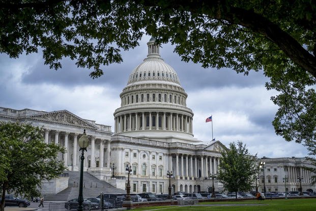 The Capitol is seen under dark skies in Washington