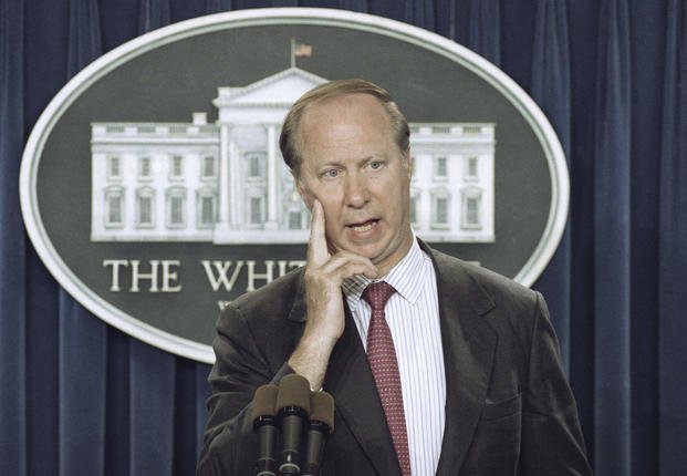 David Gergen answers a reporter's question in the briefing room of the White House.