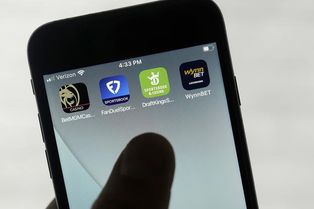 Online gambling apps are displayed on a phone in San Francisco
