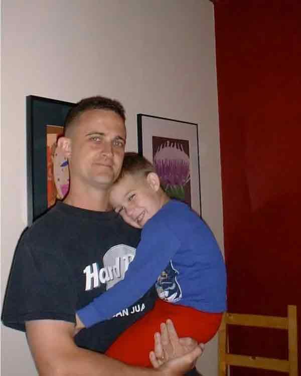 Lee, and their son, Andrew, at home in 2002