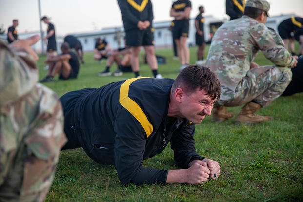 A U.S. soldier, assigned to a subordinate command under U.S. Army Europe and Africa (USAREUR-AF), performs the plank portion of the Army Fitness Test during the USAREUR-AF Best Squad Competition at Grafenwoehr Training Area, Germany.
