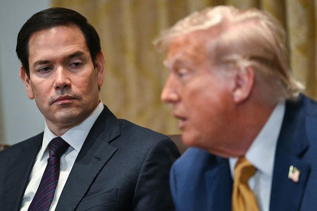 U.S. Secretary of State Marco Rubio looks on as President Donald Trump speaks during a cabinet meeting in the Cabinet Room of the White House in Washington, D.C.