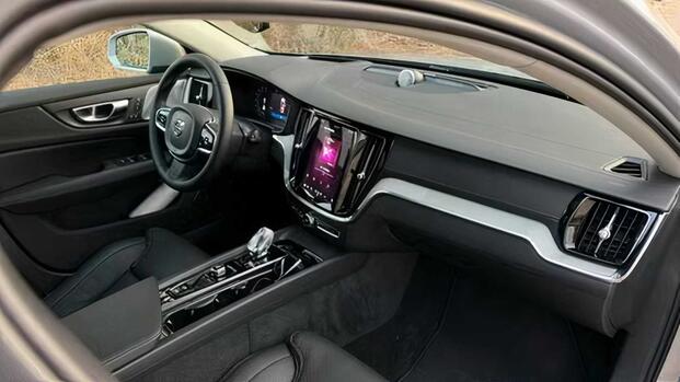 2024 Volvo V60 Cross Country - front row seat view with the passenger-side door open interior