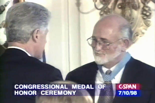 President Bill Clinton presented Petty Officer Robert Ingram with the Congressional Medal of Honor for heroism during the Vietnam war. 10 July 1998 (Screenshot from C-SPAN broadcast video)