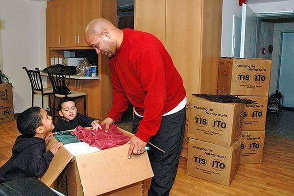 Father and children packing for a move. (U.S. Army photo)
