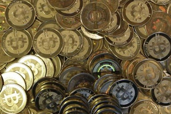 This April 3, 2013 file photo shows bitcoin tokens in Sandy, Utah. (AP Photo/Rick Bowmer, File)