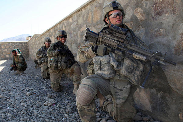 U.S. Army soldiers with Charlie Troop, 3rd Squadron, 89th Cavalry, 4th Infantry Brigade Combat Team, 10th Mountain Division wait for the order to move against enemy positions in Charkh, Logar province, Afghanistan, on Nov. 13, 2010. (Sgt. Sean P. Casey)