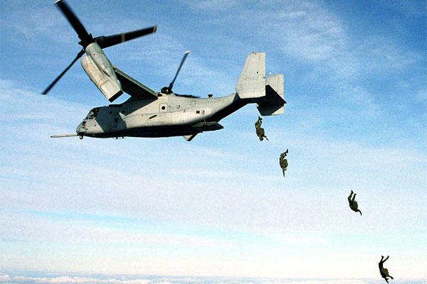 U.S. Marine Corps parachutists free fall from an MV-22 Osprey at 10,000 feet above the drop zone at Fort A.P. Hill, Va. on Jan. 17, 2000.