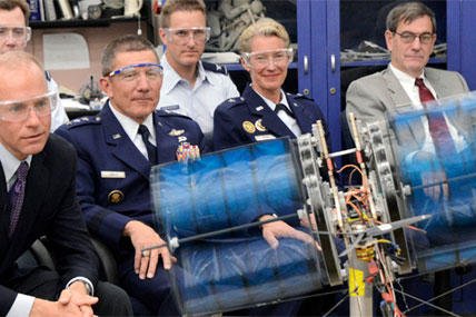 Boeing Executive Vice President Dannis Muilenburg, Air Force Academy Superintendent Lt. Gen. Mike Gould, Dean of the Faculty Brig. Gen. Dana Born and others watch a demonstration of a cadet aeronautical engineering project called the "Night Owl".