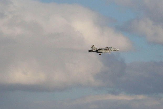 A Marine All-Weather Fighter Attack Squadron 224, F/A-18D Hornet descends to Chitose Air Base in Hokkaido, Japan, after traveling from Marine Corps Air Station Iwakuni, Jan. 12, 2016. (Photo: Cpl. Jessica Quezada)