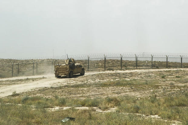 A humvee departs an explosives range aboard Task Force Al Taqaddum Air Base, Iraq, May 2, 2016. (U.S. Marine Corps photo/Sgt. Seth Starr)