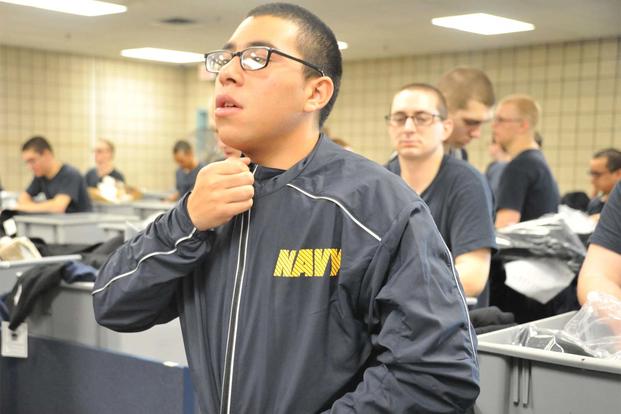 Recruits try on their newly issued fitness suits the Navy began rolling out April 24, at Recruit Training Command. (U.S. Navy photo by Susan Krawczyk/Released)