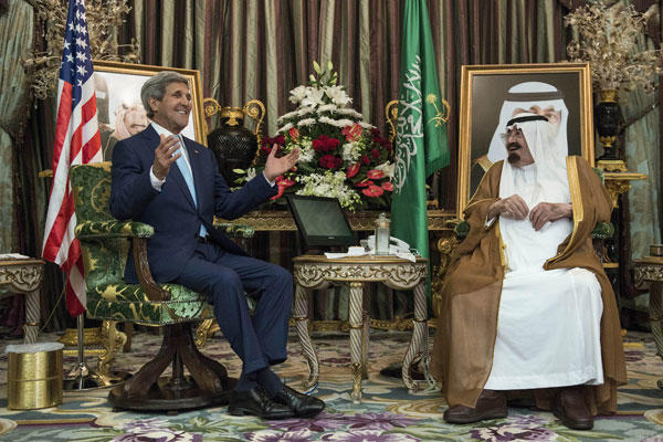 Saudi King Abdullah bin Abdul Aziz al-Saud listens to U.S. Secretary of State John Kerry before a meeting Sept. 11, 2014, at the Royal Palace in Jiddah. Key Arab allies promised to "do their share" to fight Islamic State militants. Brendan Smialowski/AP